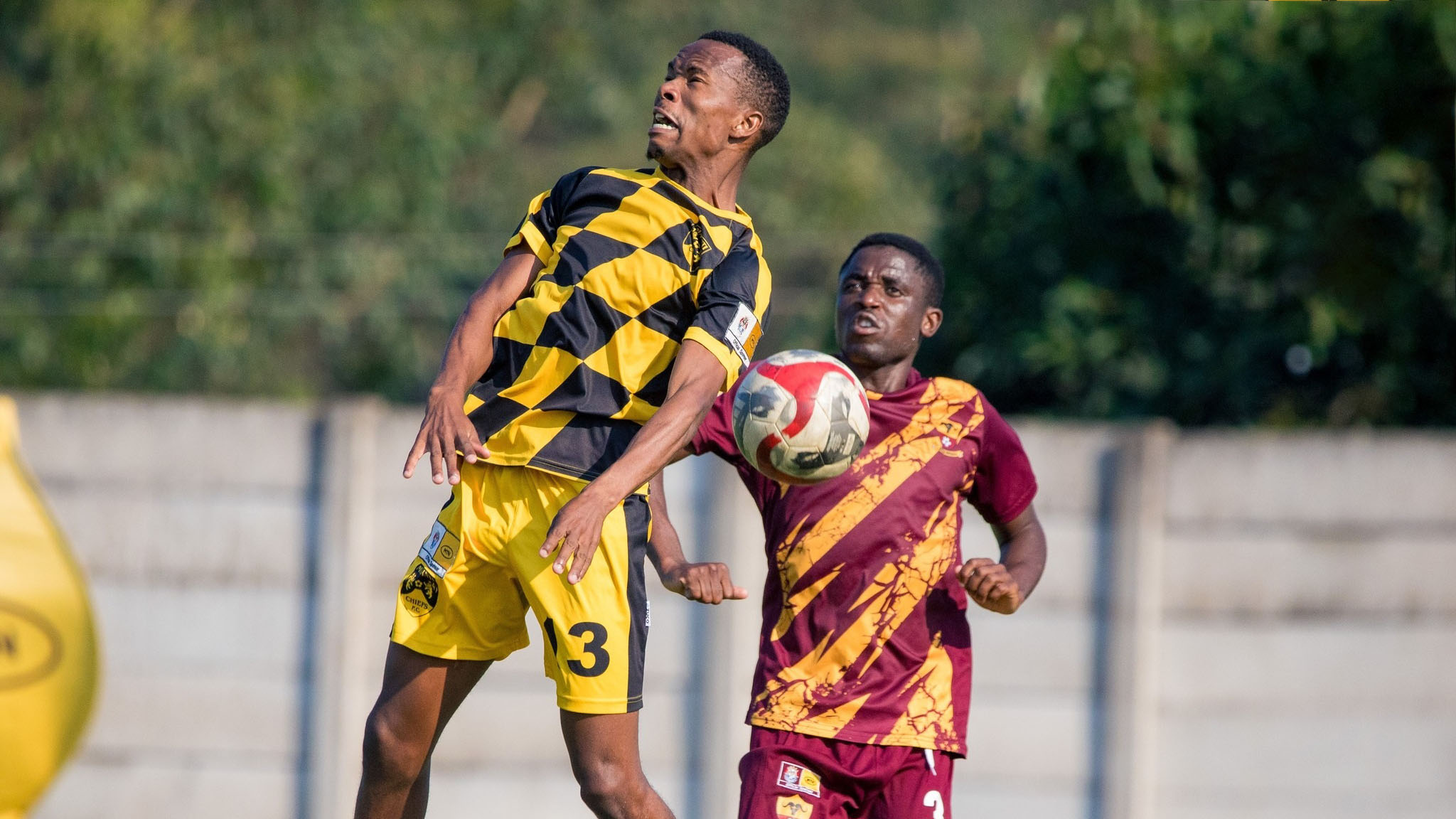 Young Buffaloes defender Siphesihle Nsimbini and Malanti Chiefs player Sanele Mamba in a missed dual header. (Pic: Young Buffaloes FB Page)